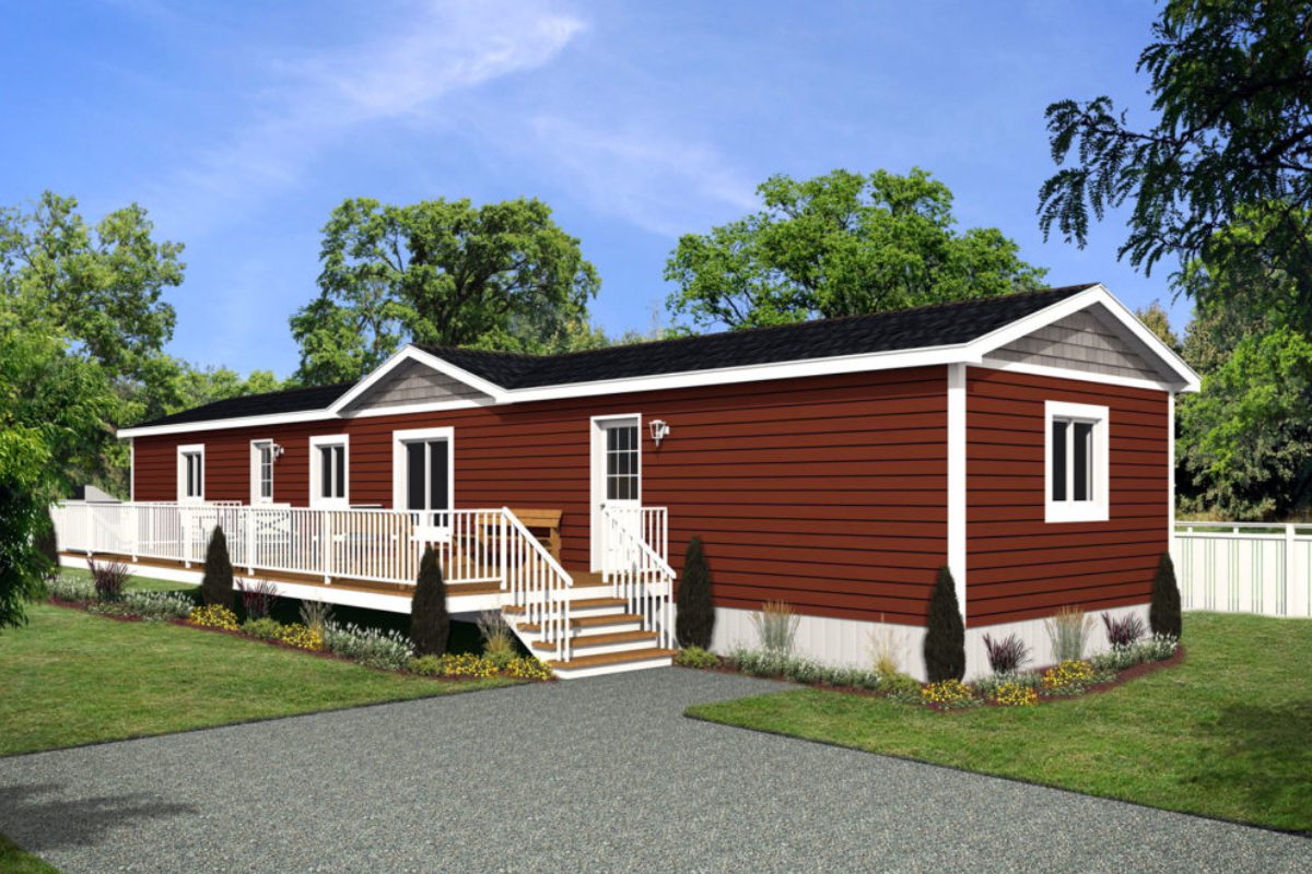 Red manufactured home with white railing, trees.